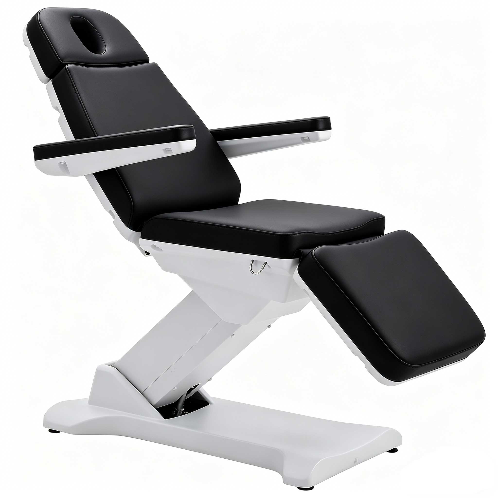 Reclining black-and-white medical chair with extended leg rest in white base. (Informative)