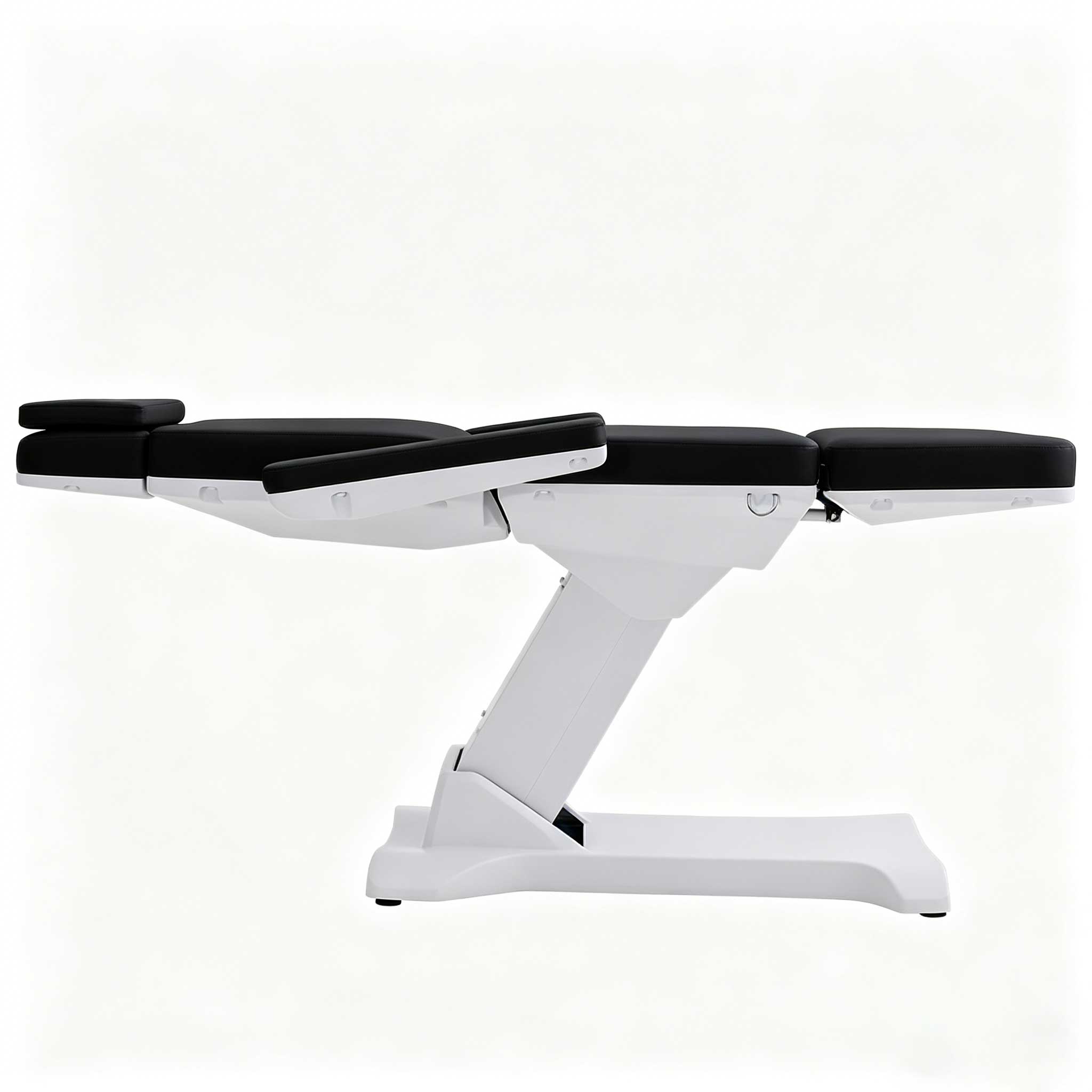 White medical examination table with segmented, adjustable black padded sections and white base, set against a light background.