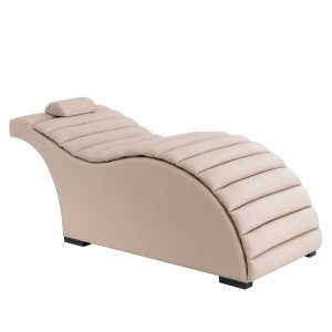 Beige upholstered chaise lounge with padded cushions and a low curved base and dark legs.
