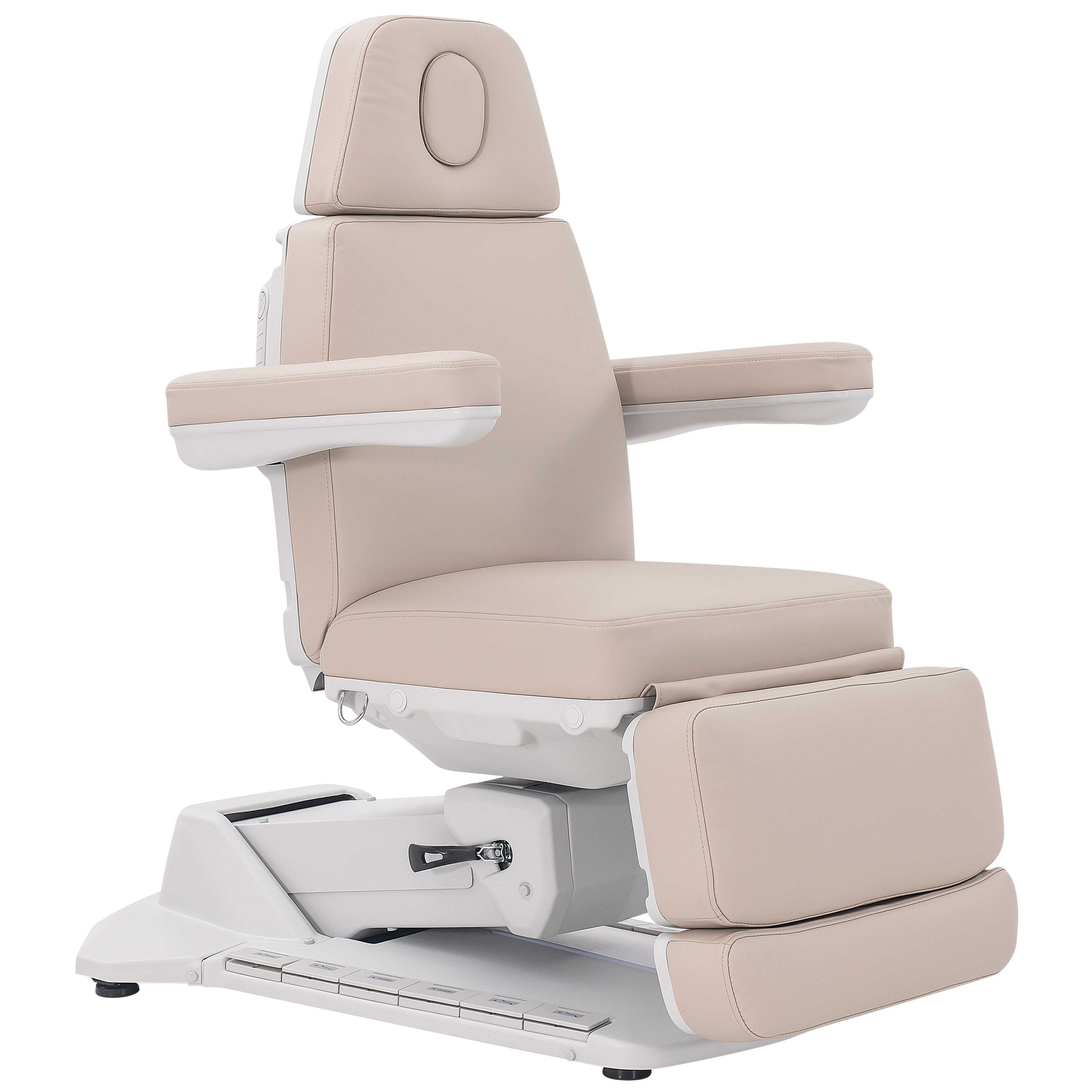 Beige reclining medical chair with padded headrest, armrests, and a footrest on a white base.