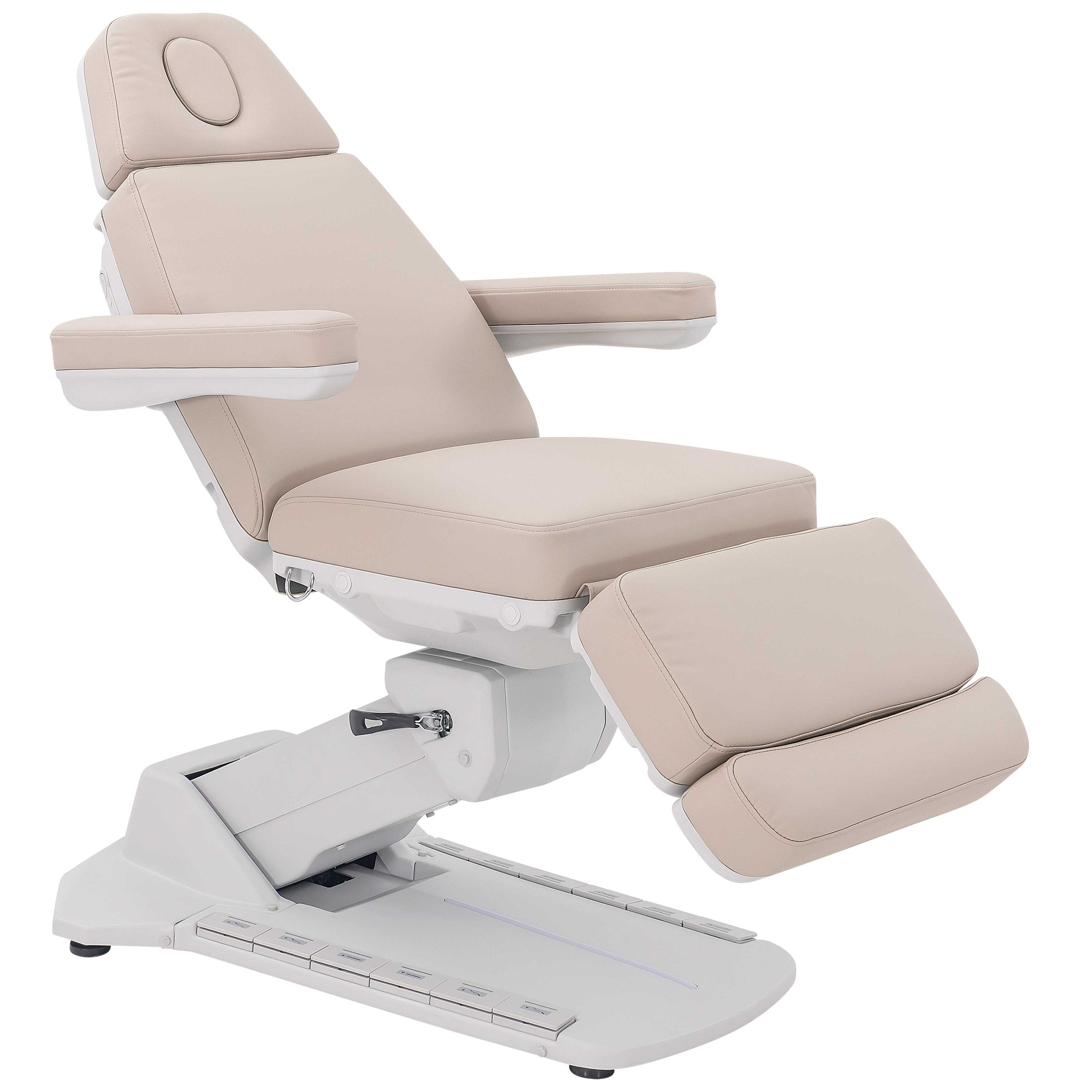 Beige padded reclining chair with armrests and adjustable leg rest viewed from the side.