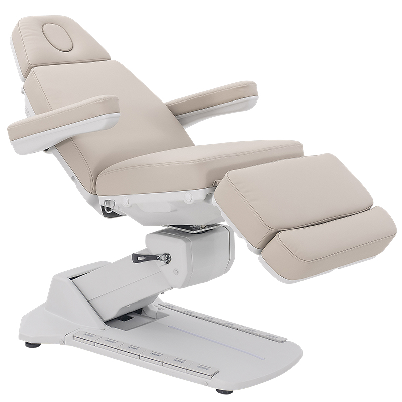 Beige reclining spa chair with padded headrest, armrests, and extendable leg rest on a white base.