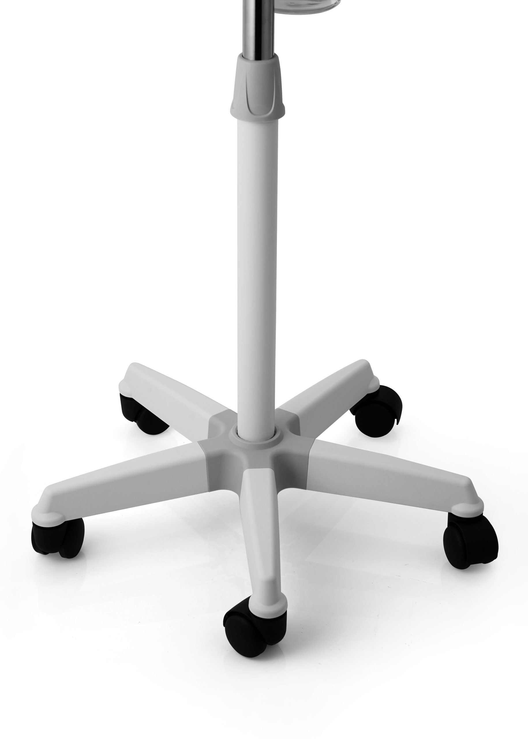 Close-up of a white office chair base with a central pole and four-armed star base, each arm ending in a black caster wheel on a white background