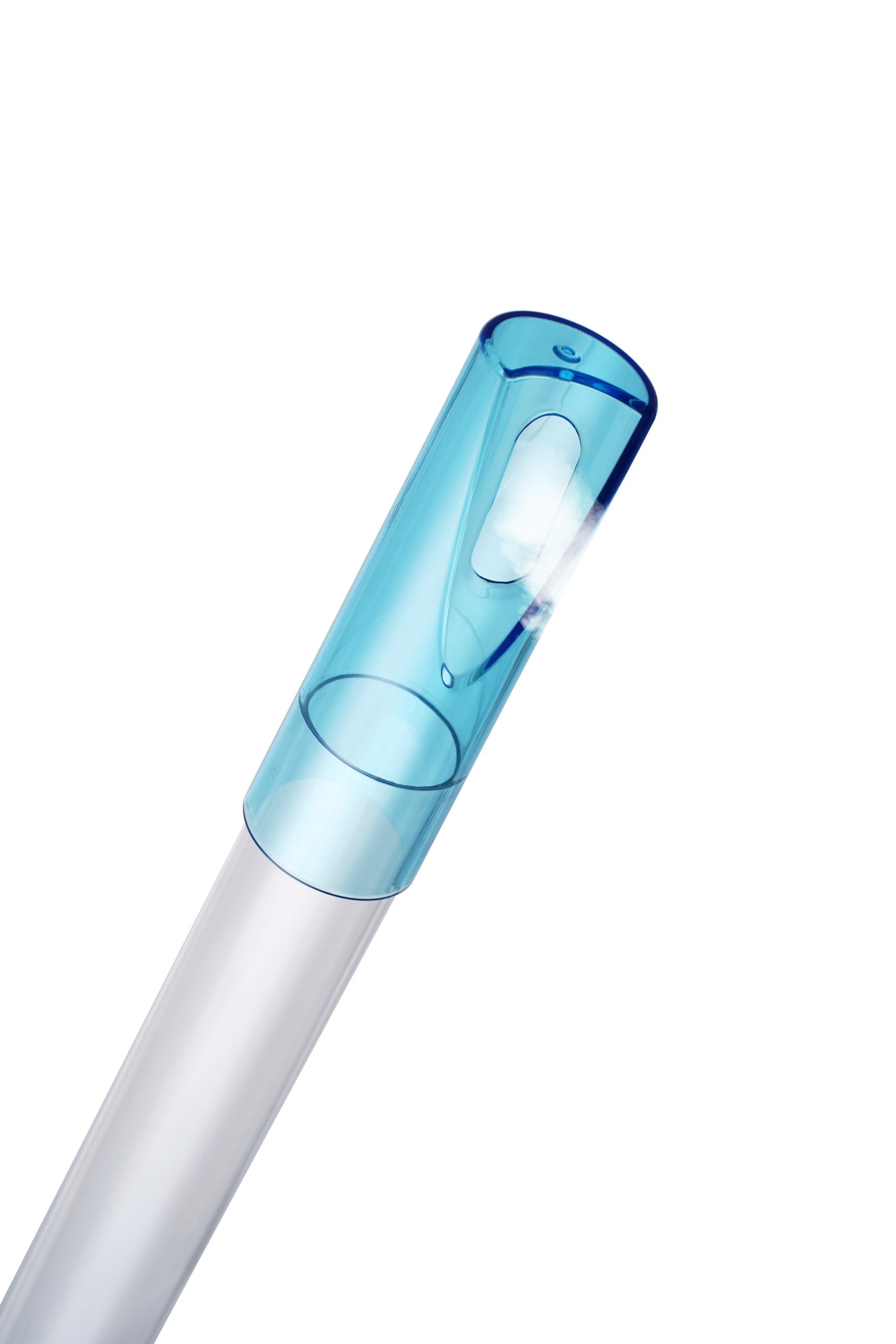 Close-up of a translucent blue cap on a diagonal, clear plastic tube.
