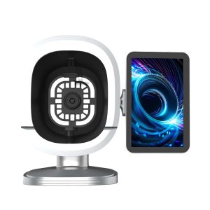White, circular optical device on a stand, connected to a side-mounted tablet showing a blue swirling pattern.