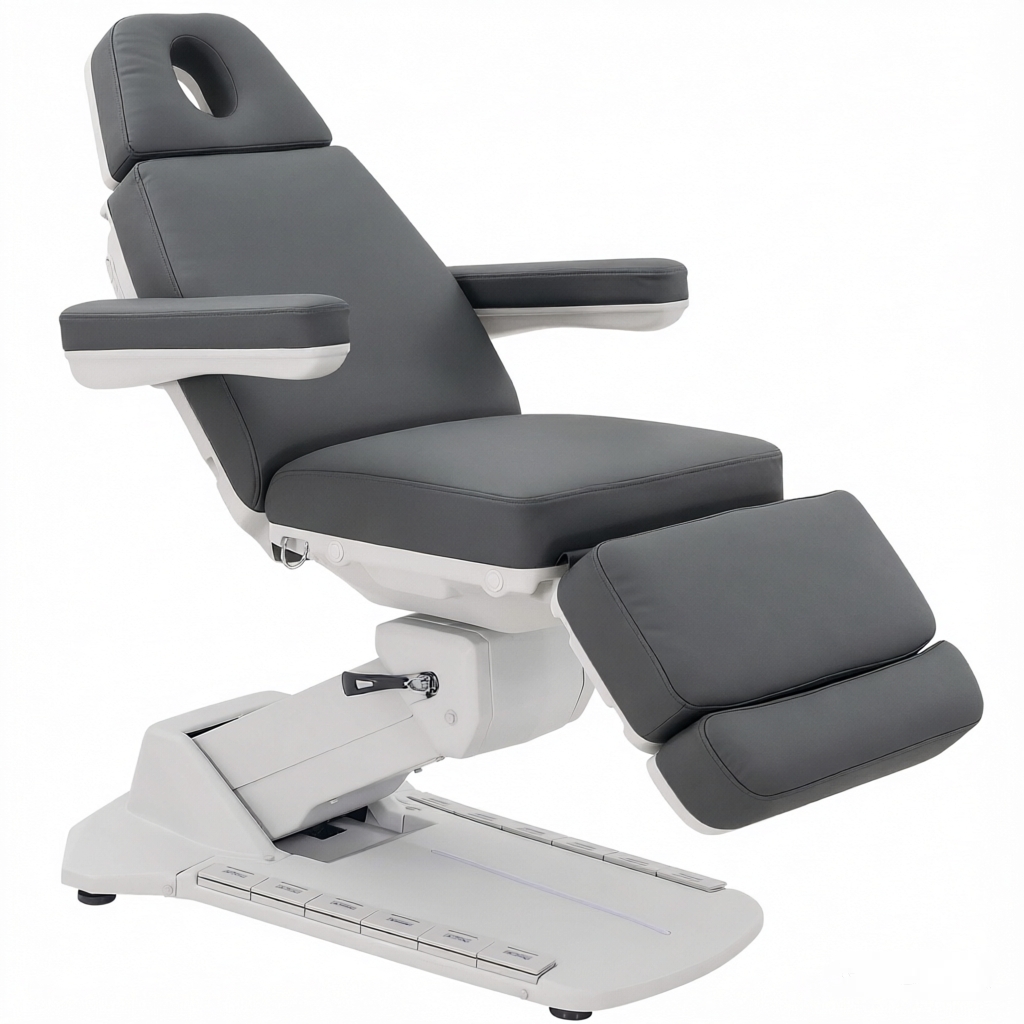 Medical or dental reclining chair with grey cushioned seat, backrest, armrests, and leg supports on a white base. Used for patient exams.