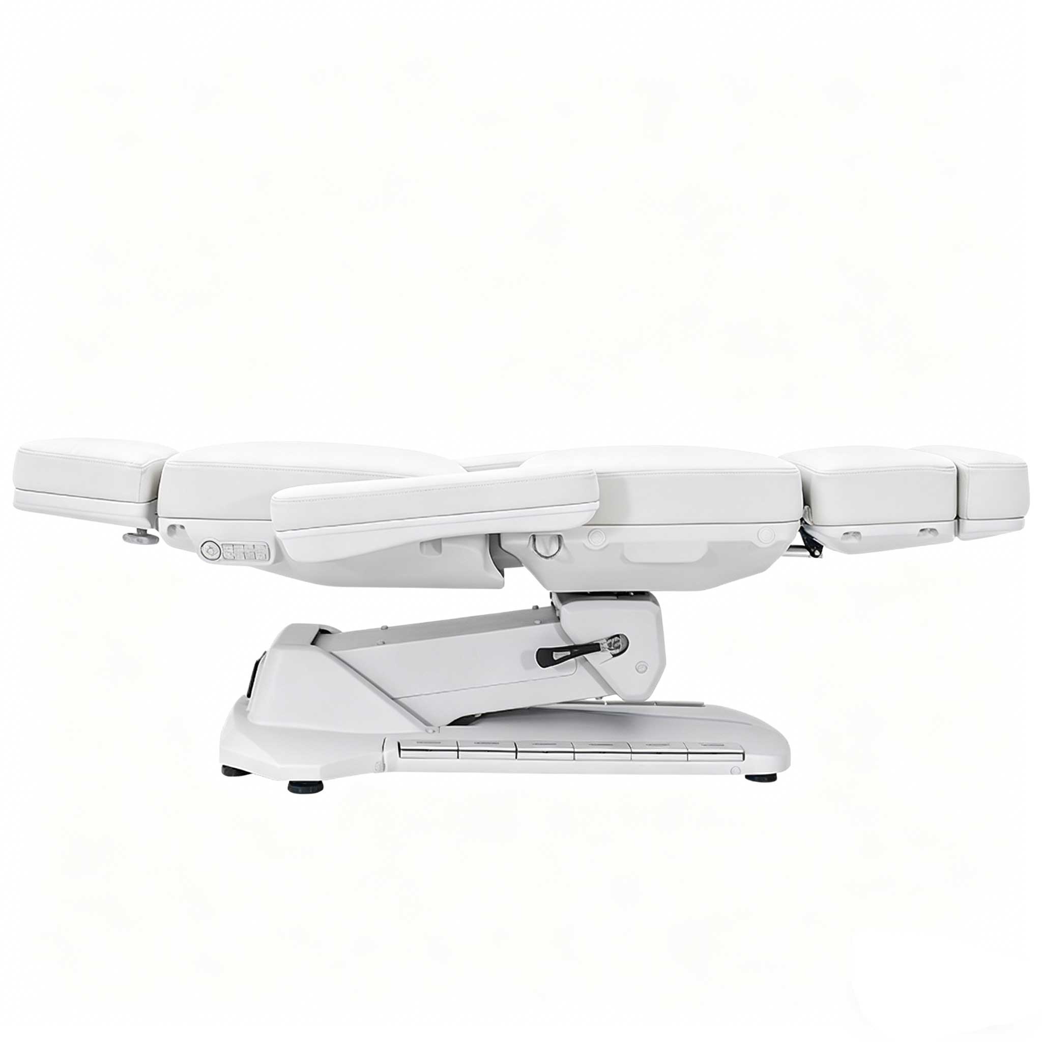 White medical reclining chair with segmented cushions against a pale background, partially shown from the side.